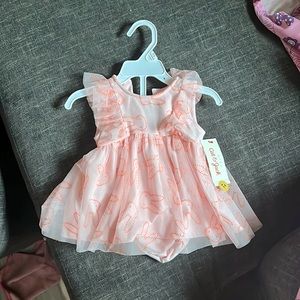 Brand new Easter dress for a baby girl , never been worn tag still attached